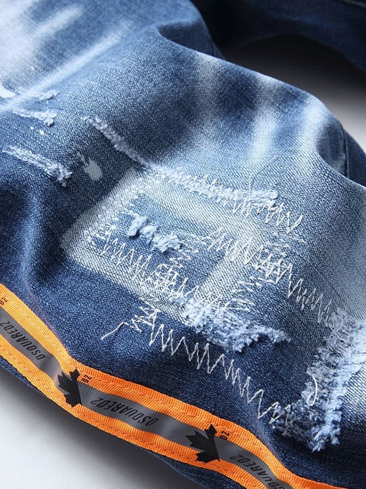 Getragene Gerade Farbblockknopf-männerjeans Mit Mittlerer Taille